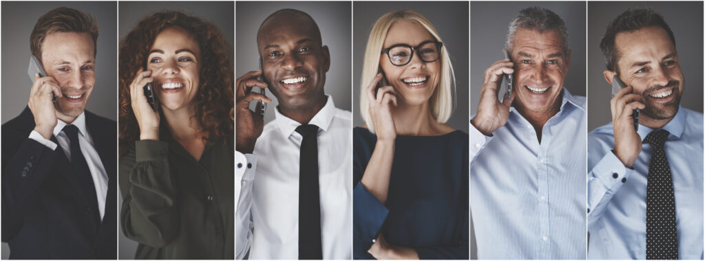 Diverse group of smiling businesspeople talking on cellphones